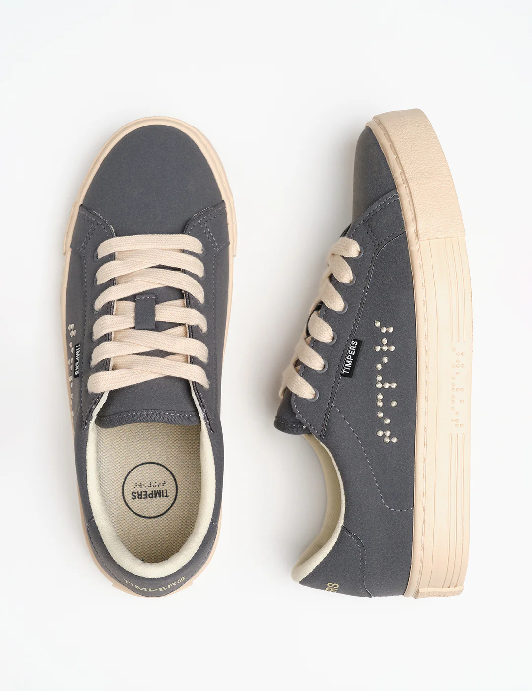 Dark grey trainers with braille